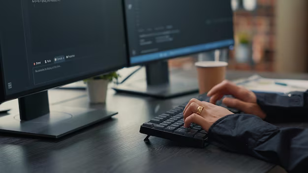 Girl's hands on a computer keyboard